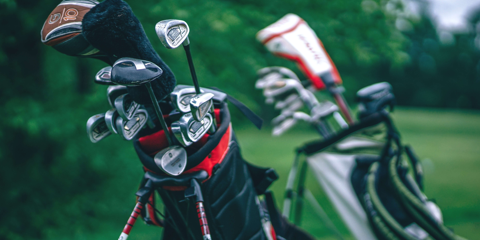 Close up of golf clubs in golf bag