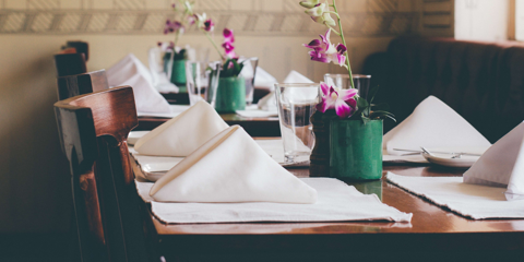 close up on napkins and table decorations on restaurant table 