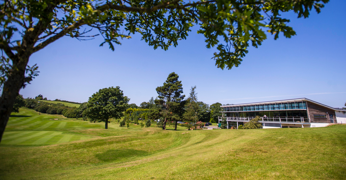 Wide angle view of club House and golf course